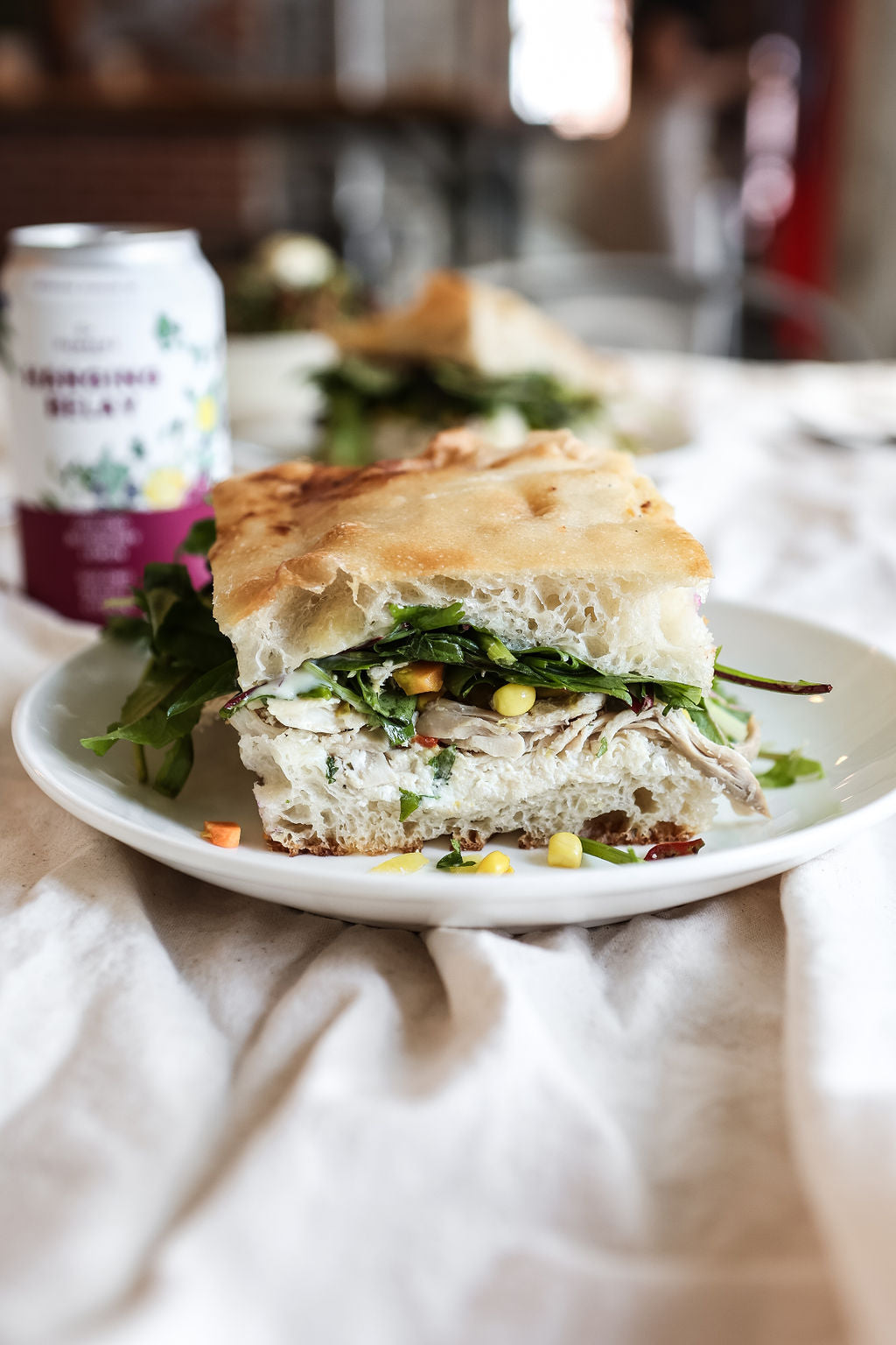 This image shows a delicious sandwich with corn and vegetables served at plate in Kingston's Juniper cafe.