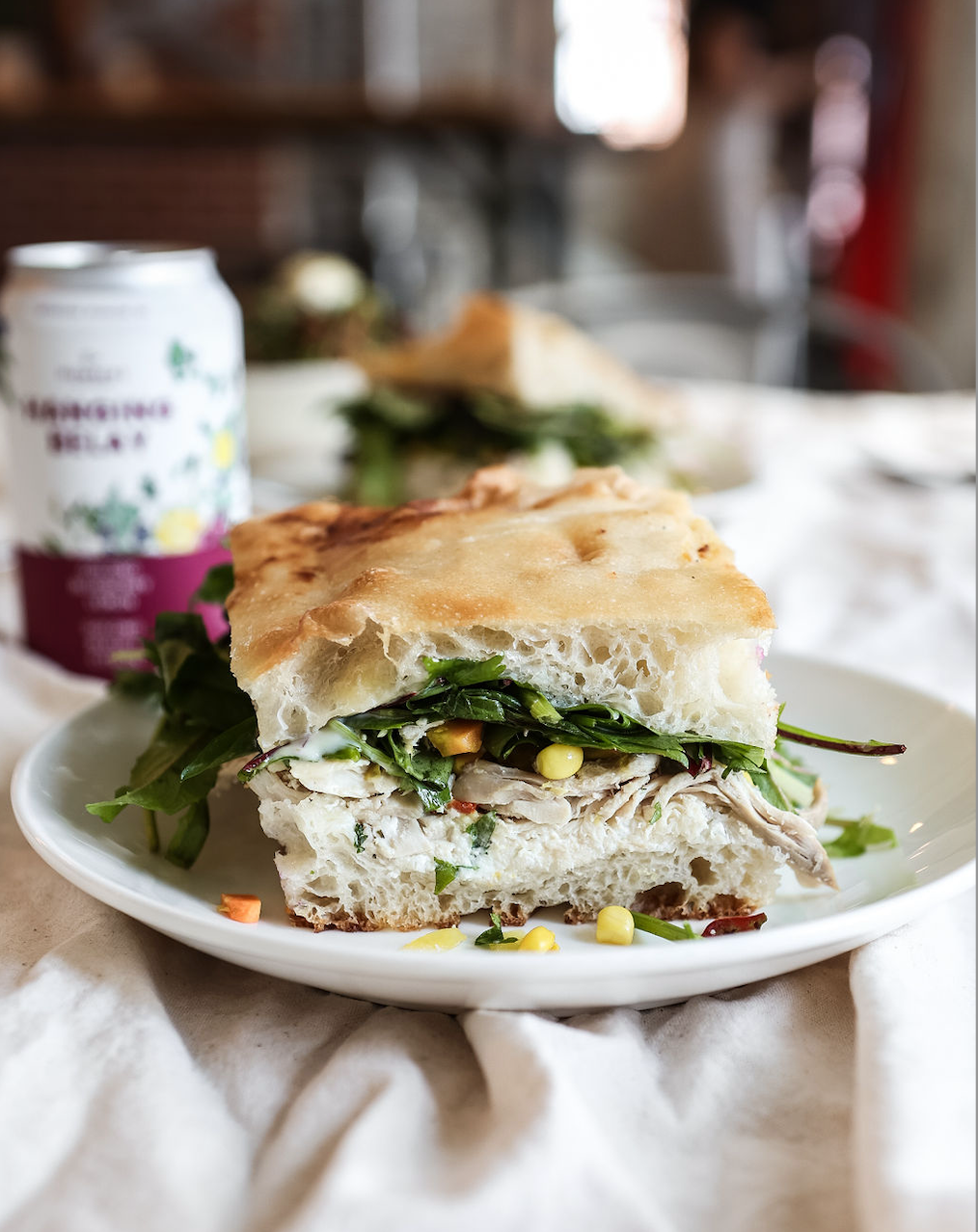 A picture showing a sandwich that includes meet, corn and vegetables as served at Juniper Cafe in Kingston.